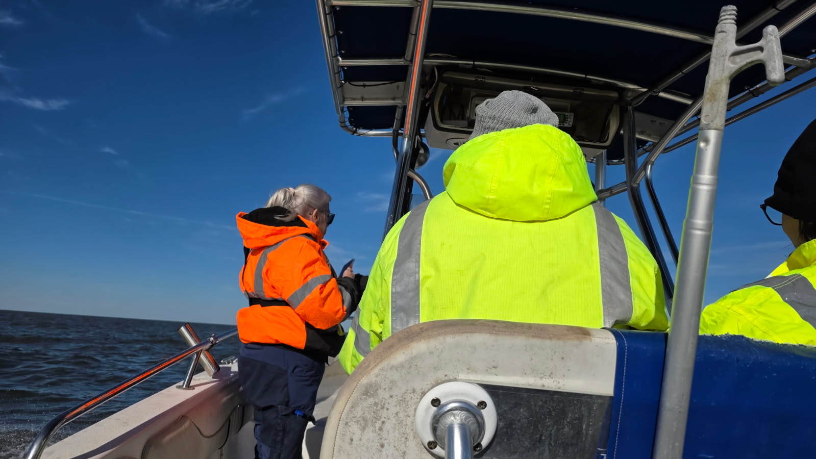 Search personnel aboard a boat on Lake Pontchartrain during the N80FP field operation